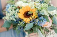 13 a bold wedding bouquet of thistles, white roses, sunflowers, greenery and some white fillers is a cool idea for a summer wedding