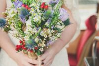 16 a bright and fun wedding bouquet with thistles, lilac and white blooms, berries and more details for an eye-catchy look