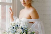 19 a chic and lovely wedding bouquet of white roses, blue blooms and thistles and eucalyptus is a chic and pretty idea