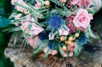 23 a cute bouquet with blue thistles, soft pink garden roses and some greenery for a sweet summer look