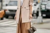 23 a white top, a chic asymmetrical skirt, white mules, a blush oversized blazer, statement accessories and a brown bag