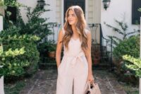 26 a neutral fitting jumpsuit with cropped wideleg pants, blush mules and a matching bag for a preppy casual look