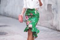 29 a floral peplum high low green skirt, a white blouse with statement sleeves, strappy heels and a pink clutch