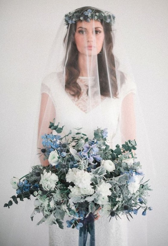 a fabulous wedding bouquet with white and blue blooms, eucalyptus, thistles and pale foliage is a lovely idea