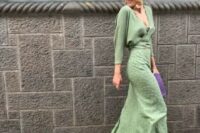 31 a lovely wedding guest ensemble with a green wrap up blouse, a green printed maxi skirt, gold shoes and a purple clutch