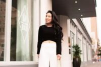 32 a bold and chic minimalist outfit with a black crop top, white wideleg pants, white shoes and a white bag