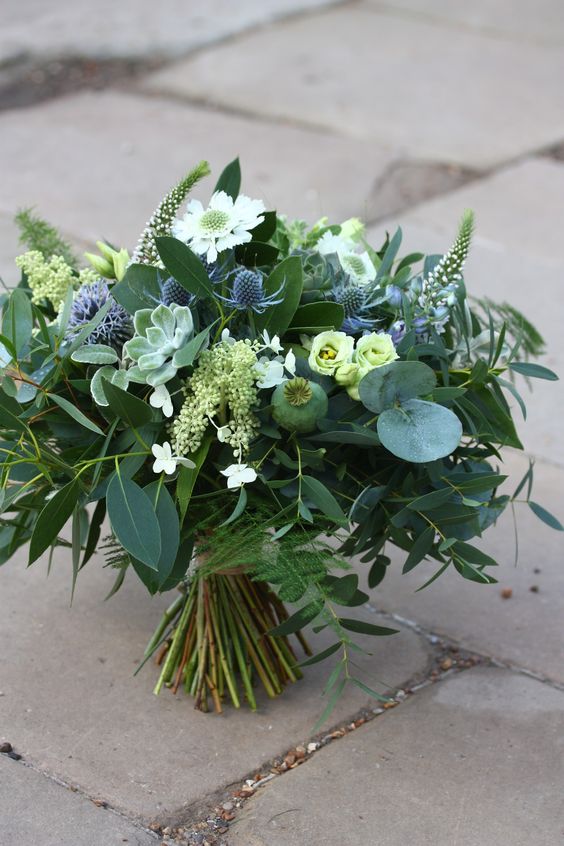 a foliage wedding bouquet with white blooms, succulents, seed pods, thistles is a lovely idea for a woodland bride