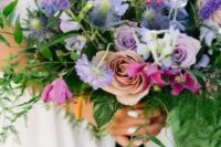 34 a gorgeous purple wedding bouquet with lilac roses, thistles, purple freesias, lisianthus and greenery cascading