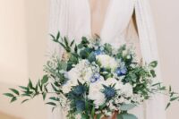 35 a gorgeous textural wedding bouquet of white roses, greenery, thistles is a super lush and adorable wedding arrangement