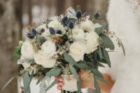 36 a gorgeous wedding bouquet with white roses, thistles and berries plus greenery for a refined winter bride is simple and stylish