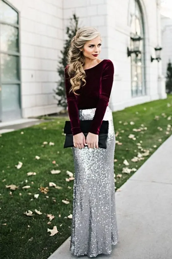 a deep purple velvet top with long sleeves, a silver sequin maxi skirt and a black clutch for a breathtaking look