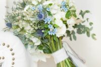 41 a lovely wedding bouquet of white blooms, blue flowers and thistles and some greenery is a stylish and catchy idea