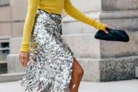 41 a sunny yellow turtleneck, a silver fringe skirt, a chain necklace, yellow snakeskin print shoes and a black clutch