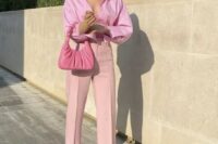 42 a pink wedding guest outfit with a top, an oversized shirt, high waisted pants with slits, pink shoes adn a small bag