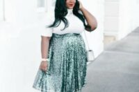 42 a white turleneck with short sleeves, a green high waist sequin midi, black shoes and an off-white bag