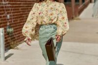 43 a pretty and elegant vintage-inspired wedding guest look with a tan floral blouse with puff sleeves, mint-colored pants, white shoes and a brown bag