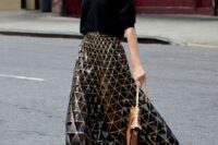45 a black oversized sweater, a blakc and gold geometric midi skirt, black lace up shoes and a camel bag