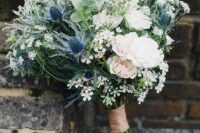 49 a romantic wedding bouquet of white and blush blooms, thistles, greenery and waxflowers is a lovely idea for a rustic wedding