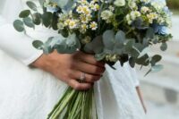50 a stylish wedding bouquet of blue hydrangeas, chamomiles, thistles, eucalyptus is a catchy and chic idea for a modern bride