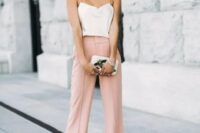 52 pink wideleg pants, a creamy spaghetti strap top, statement earrings, a small clutch with appliques for a casual summer wedding