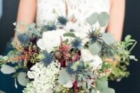 54 a textural wedding bouquet of white roses, various wildflowers, thistles, greenery and cascading elements is a lovely idea