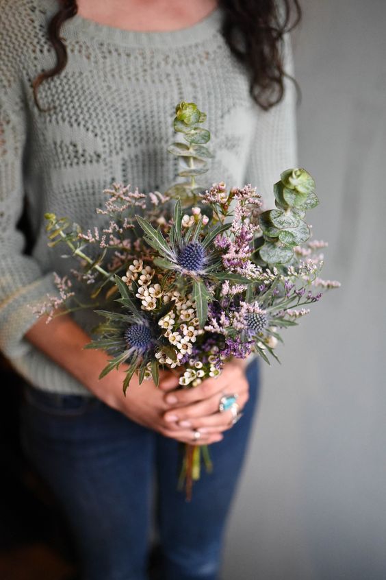 a textural wedding bouquet with waxflowers, thistles, greenery and some smaller blooms is a lovely idea for a relaxed wedding