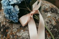 a blue hydrangea mono wedding bouquet with a blush ribbon bow is a catchy and lovely idea for spring or summer