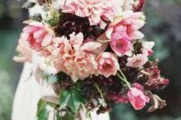 a bold fall wedding bouquet of deep purple and pink dahlias, pink tulips and greenery is a very eye-catchy idea