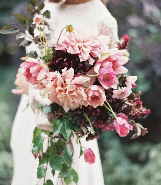 a bold fall wedding bouquet of deep purple and pink dahlias, pink tulips and greenery is a very eye-catchy idea