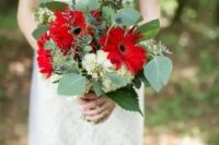 a bold wedding bouquet with red gerberas, white hydrangeas, thistles and greenery is amazing