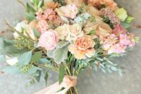a breezy wedding bouquet of peach carnations, quicksand roses, white majolica spray roses, lisianthus, peach stock, calcynia, gunni eucalyptus, seeded eucalyptus