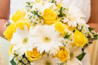 a bright wedding bouquet of white gerberas, yellow roses, chamomiles and greenery is a fun and colorful idea for spring and summer
