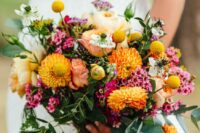a bright wedding bouquet of yellow dahlias, pink waxflower, billy balls and greenery is a catchy and stylish solution