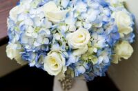 a catchy wedding bouquet of white roses and blue hydrangeas is a lovely idea for spring or summer
