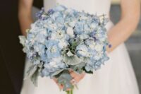 a small cute blue wedding bouquet