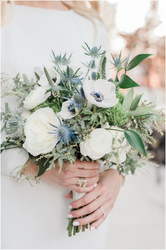 a chic wedding bouquet of white blooms, thistles and greenery plus astilbe is a lovely idea for spring or summer