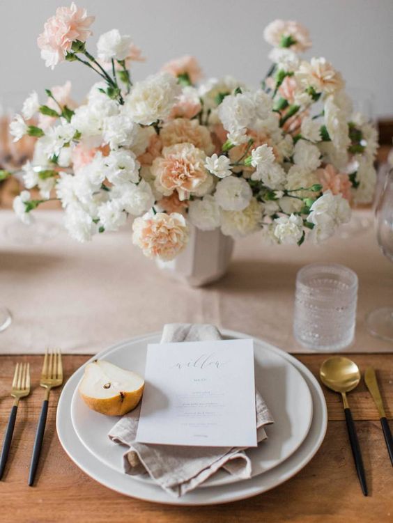 a classy modern wedding centerpiece of blush and white carnations and nothing else is a cool and stylish idea for a wedding