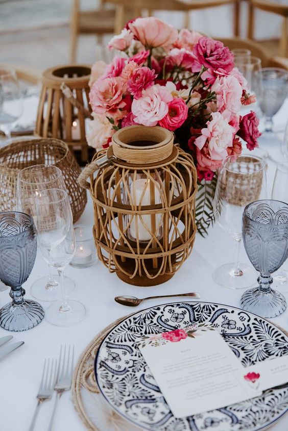 a colorful wedding centerpiece of blush, pink and hot pink carnations and other blooms is a cool idea for a bold wedding