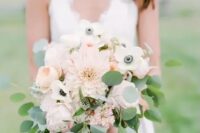 a delicate spring or summer wedding bouquet of blush peonies and dahlias plus white anemones and eucalyptus is chic
