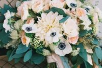 a delicate summer wedding bouquet in pastels with blush roses, dahlias and white anemones plus lots of eucalyptus