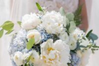 a delicate wedding bouquet of blue hydrangeas, white peonies, greenery and fern is a cool idea for a spring or summer bride