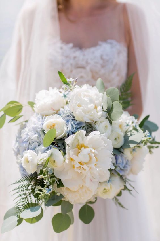 a delicate wedding bouquet of blue hydrangeas, white peonies, greenery and fern is a cool idea for a spring or summer bride