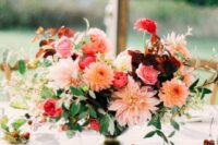 a fab summer wedding centerpiece of blush, peachy and coral dahlias, roses, ranunculus, greenery is wow