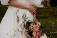 a fab wedding bouquet of blush carnations and roses, waxflower, greenery and some grasses is adorable
