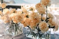 a gorgeous neutral carnation wedding centerpiece of clear glass boxes is a cool idea for a modern wedding