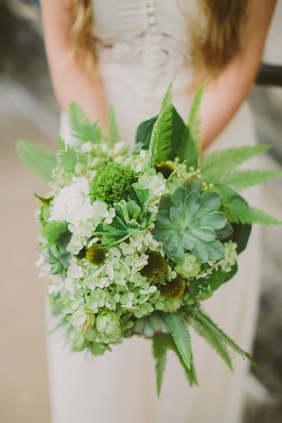 a green wedding bouquet of hydrangeas, succulents, greenery white blooms and ferns, fern leaves is a cool and bold idea