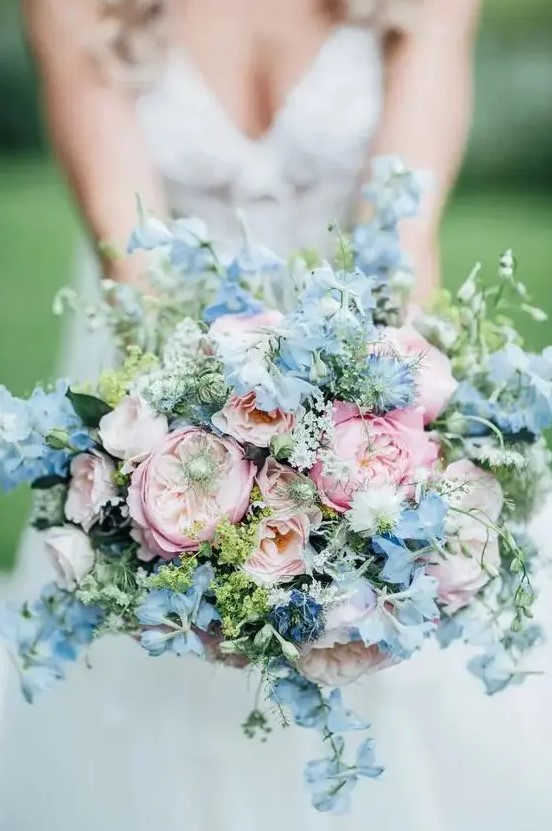 a lovely pink and blue wedding bouquet with peony roses and delphinium is a gorgeous idea for spring or summer