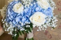 a lovely wedding bouquet of blue hydrangeas, baby’s breath and white roses is a catchy idea for spring or summer