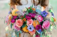 a lush colorful bouquet in pink, yellow, purple and fuchsia plus eucalyptus is a gorgeous option if you want a colorful wedding bouquet
