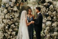 a lush wedding arch styled with greenery, white and blue blooms is a fantastic idea that wows, it will have a big impact on the space